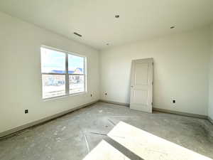 Spare room with concrete flooring