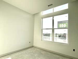 Empty room featuring concrete floors