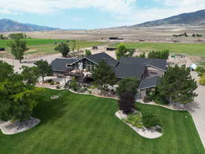 Bird's eye view with a mountain view. Beautiful new roof installed in 2024