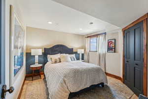 Bedroom with a closet and light wood-type flooring