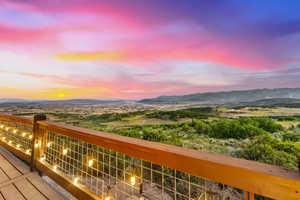 Balcony at dusk with a mountain view