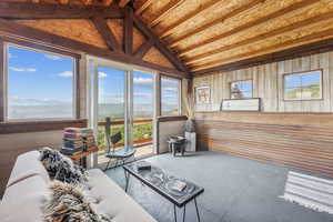 Sunroom with lofted ceiling and a healthy amount of sunlight