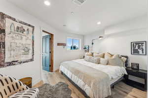 Bedroom with light wood-type flooring