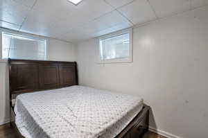 Bedroom featuring dark hardwood / wood-style floors