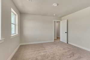 View of carpeted spare room