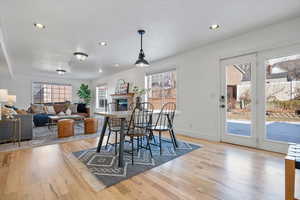 Dining area with light hardwood / wood-style flooring