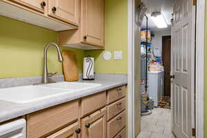 View of laundry room and garage door