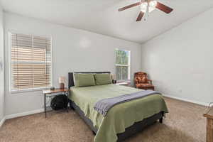 Primary bedroom with ensuite Bathroom and vaulted ceiling