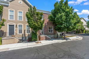 Beautiful brick exterior with mature trees