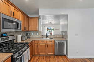 Updated kitchen with backsplash, handles and new faucet