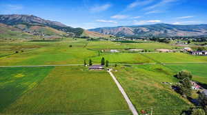 Drone / aerial view featuring a mountain view and a rural view