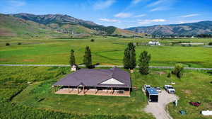 Drone / aerial view featuring a mountain view and a rural view