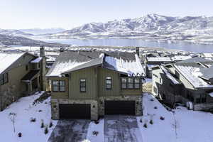 Snowy aerial view featuring a mountain view