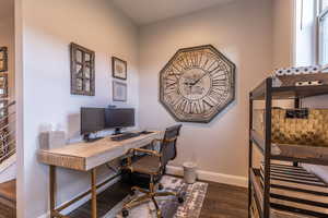 Office space featuring dark hardwood / wood-style flooring