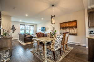 Dining space featuring dark hardwood / wood-style floors