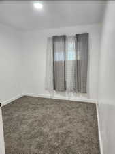 View of carpeted spare room