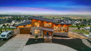 View of front of house featuring a garage and a mountain view