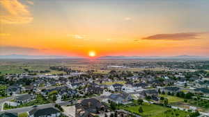 Aerial view at dusk featuring a mountain view