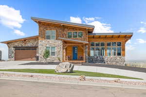 View of front of property with a garage