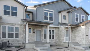 View of front of property featuring central AC unit