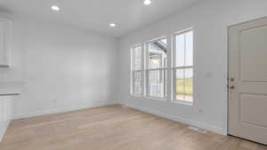 Unfurnished living room featuring light hardwood / wood-style floors