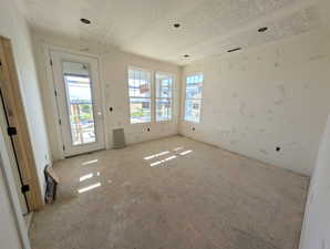 Primary bedroom with balcony. Progress photo of actual home