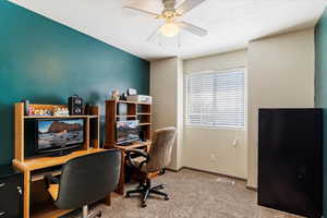 Office featuring light carpet, a textured ceiling, and ceiling fan