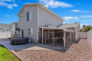 Rear view of property with a patio