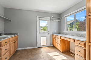 Bathroom with vanity and tile patterned floors