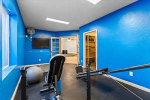 Workout room featuring ceiling fan