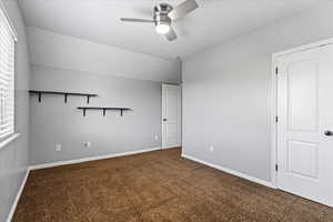 Interior space featuring carpet flooring and ceiling fan