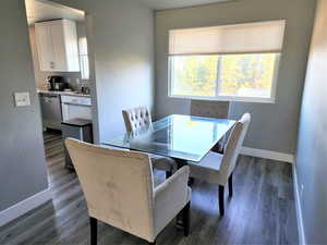 Dining area with hardwood / wood-style flooring