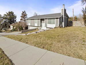 View of front of property with a front yard