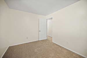 Unfurnished room featuring carpet floors