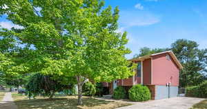 View of property hidden behind natural elements