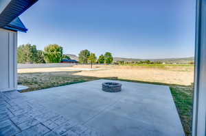 View of patio / terrace with an outdoor fire pit