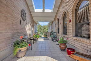 View of patio / walk way to house and garage, and bonus room