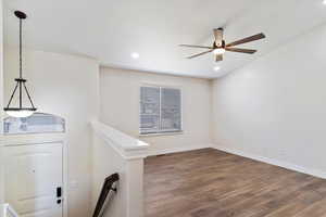 Interior space with wood-type flooring and ceiling fan