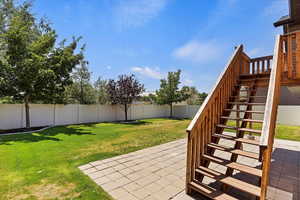 View of yard with a patio