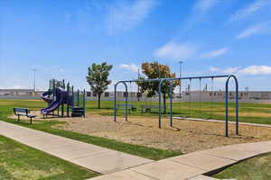 View of play area with a yard