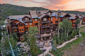 Aerial view at dusk featuring a mountain view