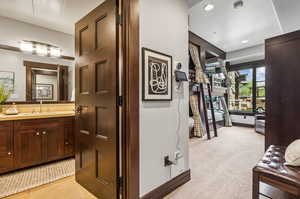 Bathroom with tile patterned flooring and vanity