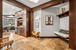 Interior space with light hardwood / wood-style floors and beverage cooler