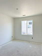 Unfurnished room with a textured ceiling