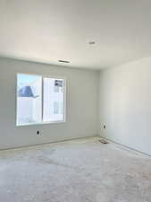 Empty room with a textured ceiling