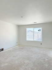 Unfurnished room with a textured ceiling