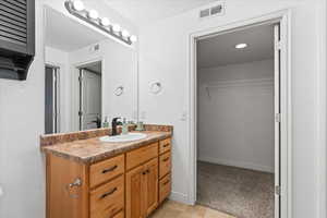 Master bathroom featuring vanity and tile patterned floors