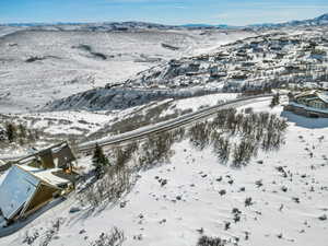 Snowy aerial view with a mountain view