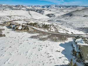 Snowy aerial view with a mountain view