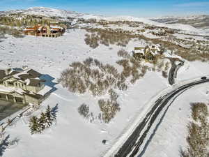 Snowy aerial view featuring a mountain view